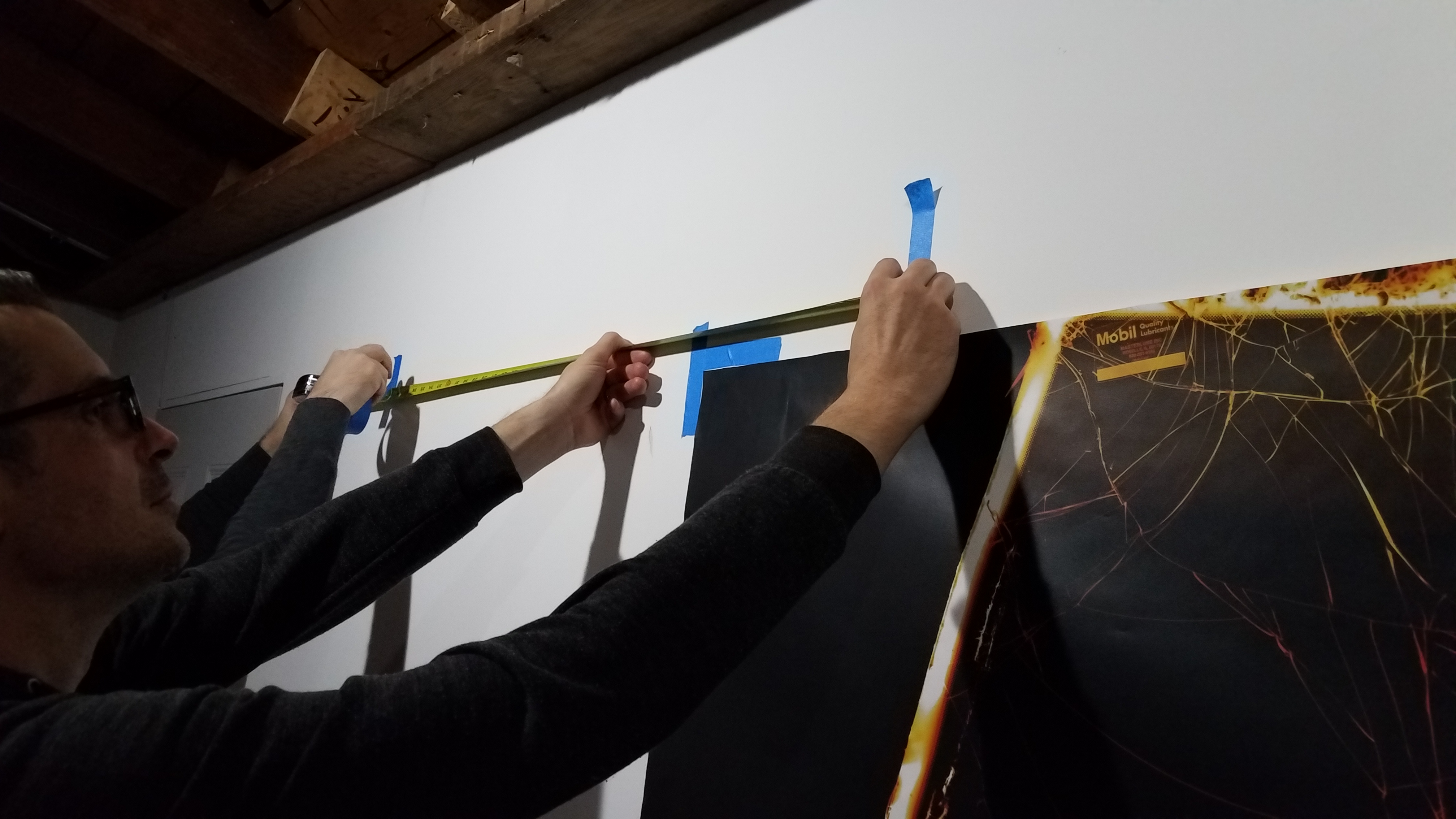 Hanging prints with tape measure